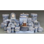 A large collection of Wedgwood Jasperware ceramics including vases, clock, candlesticks, picture