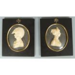 Pair of 20thC carved wax silhouettes by Lesley Ray, London, depicting a lady and military gentleman,