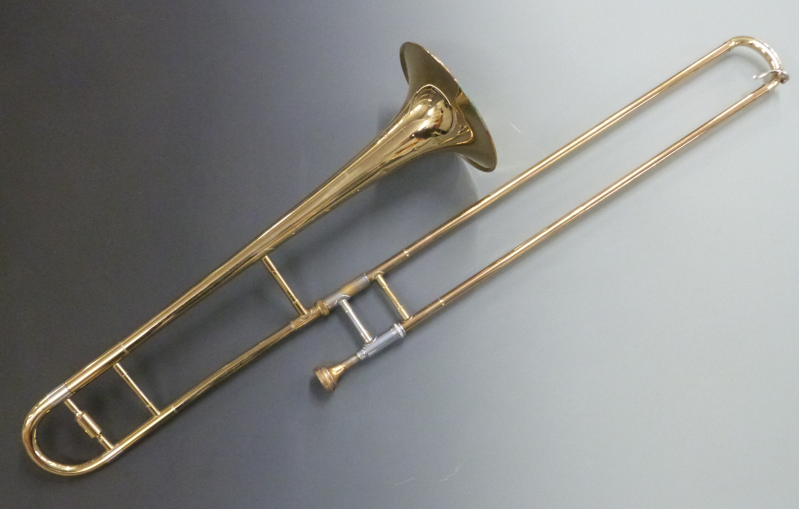 Blessing Scholastic Elkhart USA brass and plated trombone, serial no 257719 with Denis Wick London