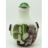 Chinese glass overlay scent bottle with decoration depicting a figure and insects, 6.5cm tall