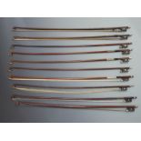 Ten round stick violin bows with various button types, plain eyes to frogs