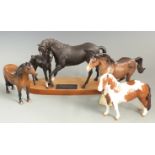 Four Beswick horses, Skewbald, Cowboy's horse, Black Beauty with foal and Dartmoor, tallest 20cm