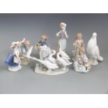 A collection of Lladro and Nao figures, tallest 24cm