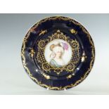 A 19thC cabinet plate with hand-painted rondal of a lady, possibly by Sampson of Paris, Vienna