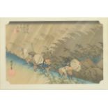 A 19th/20thC Japanese print of travellers on a hillside in a storm, 22 x 34cm