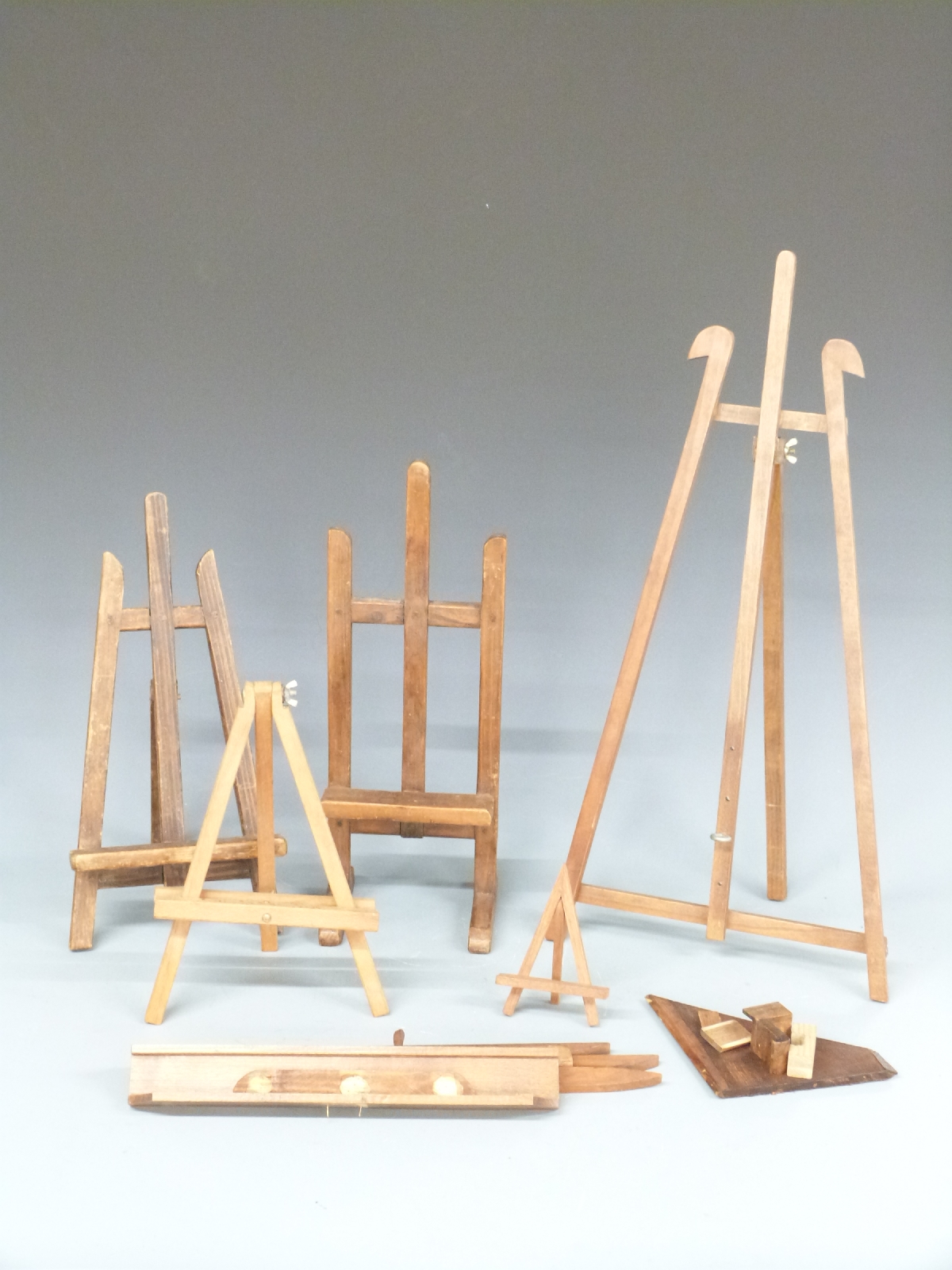 Five small table top artist's easels, tallest 58cm