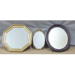 Oval and octagonal bevelled glass mirrors, largest 63cm