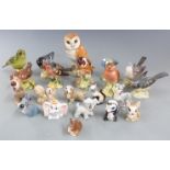 A collection of Beswick birds and Wade figures, mostly Disney, tallest 11.5cm