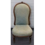 Mahogany upholstered nursing chair with ceramic castors