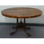 Victorian inlaid tilt top table raised on four carved legs, W120 x D88 x H70cm