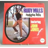 Rudy Mills - Reggae Hits (SEC012) record and cover appear at least Ex