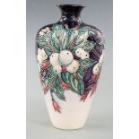 Moorcroft vase decorated with foliage and berries dated 2002, H16cm
