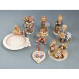 A collection of Goebel Hummel figures, pin tray, tableau etc, tallest 14cm