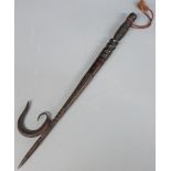 A tribal hardwood and metal elephant goad, 46cm long