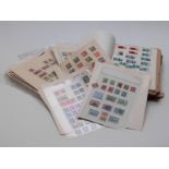 A large quantity of mint and used GB stamps and foreign stamps on loose album sheets