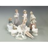 A collection of Nao figures, swans etc, tallest 25cm