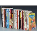Thirty comic related books including The Cartoon History of the Universe, Dick Tracy Casebook,