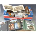 Two postcard albums and a large quantity of loose cards, Edwardian onwards to include Swanage,