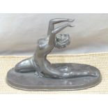 A figurine of a semi-nude female dancer