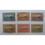 New Guinea 1939 part set light used stamps including 5s and 10s (SG 223 and 224). Also £1