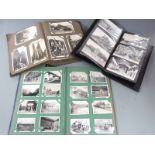 Three postcard and photograph albums containing mainly Continental postcards, early 20thC onwards,