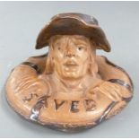 Royal Doulton Lambeth stoneware 'Saved' matchstriker or inkwell formed as a drowning man in a