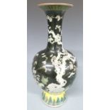 A 19thC Chinese famille noir pedestal vase with prunus decoration, 40cm