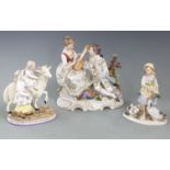 Dresden style figure of sweethearts, a figural group of a child riding a goat and a German figure of