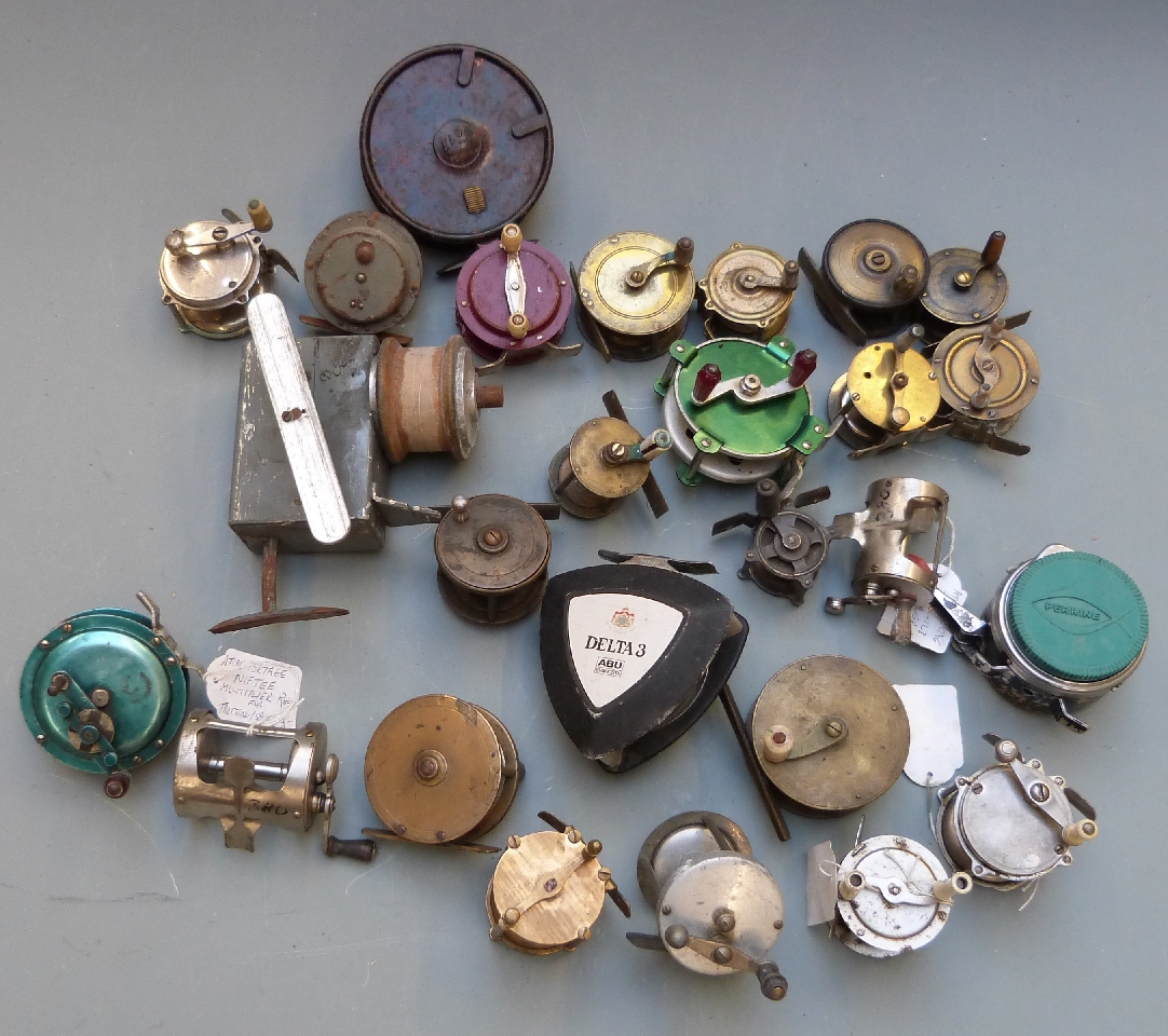 Collection of twenty six anonymous 19th/20thC brass fishing reels including Abu Delta 3 fly reel,