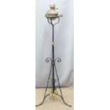 A wrought iron adjustable oil lamp and stand, H141cm
