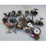 Large quantity of vintage fishing reels including Intrepid, Shakespeare and Mitchell, spools and