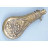 G & J W Hawksley brass powder flask with embossed decoration to both sides, 19cm long.