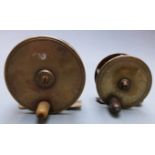 Two brass fishing reels, possibly Hardy, diameter 7.7 and 9.4cm