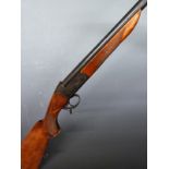 Baikal IJ-18 12 bore single barrelled shotgun with engraved animal scenes to the lock, chequered