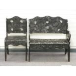 A wooden bench seat and chair with profusely carved flower decoration c1920s/30s, the bench W91