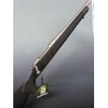 Remington Model 700 .25-06REM bolt-action rifle with semi-pistol grip, sling suspension mounts and