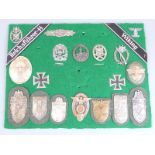German Third Reich Nazi replica war badges and battle shields together with two Iron Crosses mounted