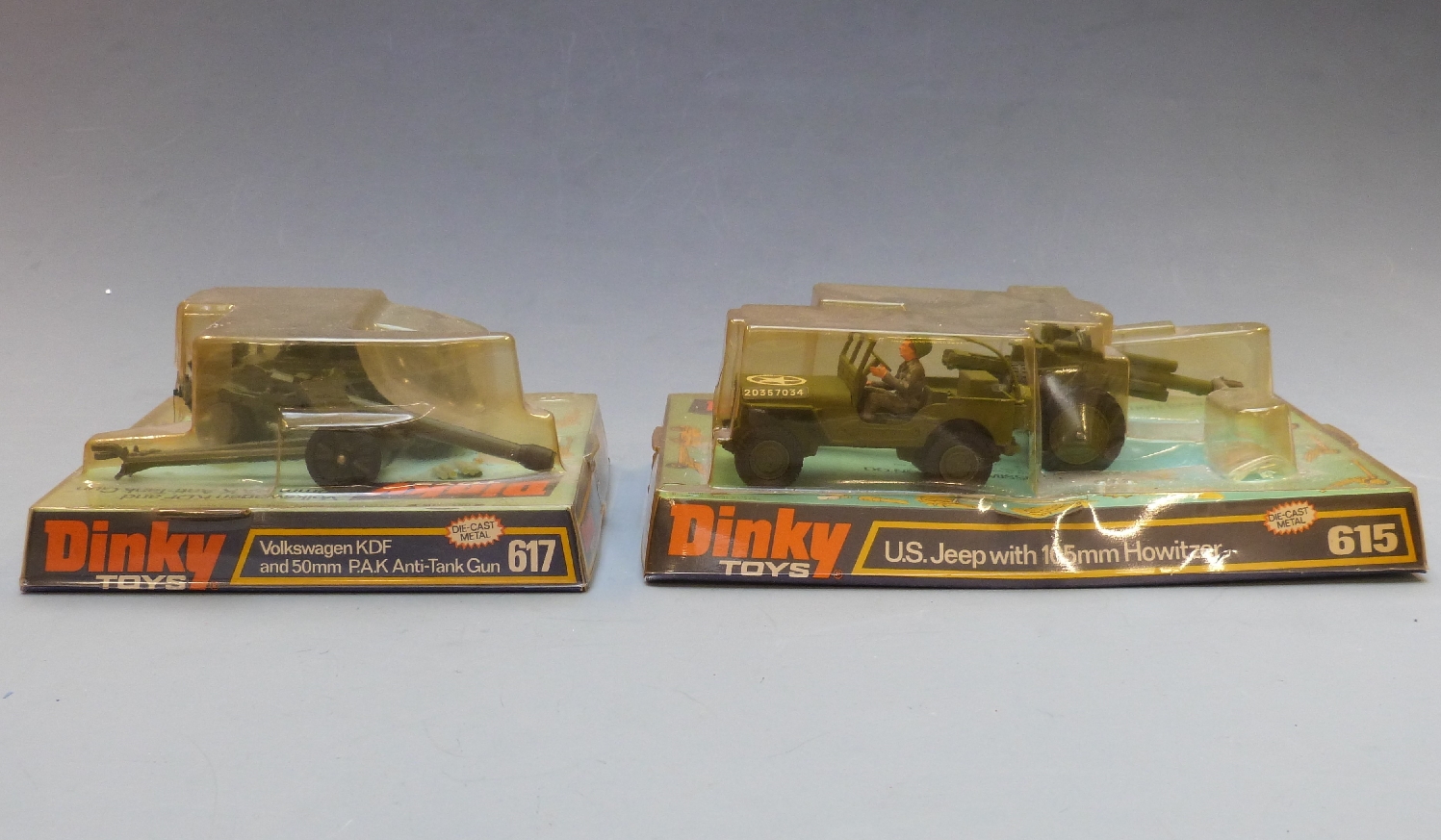 Two Dinky Toys diecast model military vehicles US Jeep with 105mm Howitzer 615 and Volkswagen KDF