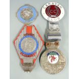 Four car badges including National Trust for Scotland, Safety Courtesy, Caravan Club and Wales