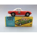 Corgi Toys diecast model Lotus Elan Coupe with red body, white top, white interior, cast hubs and