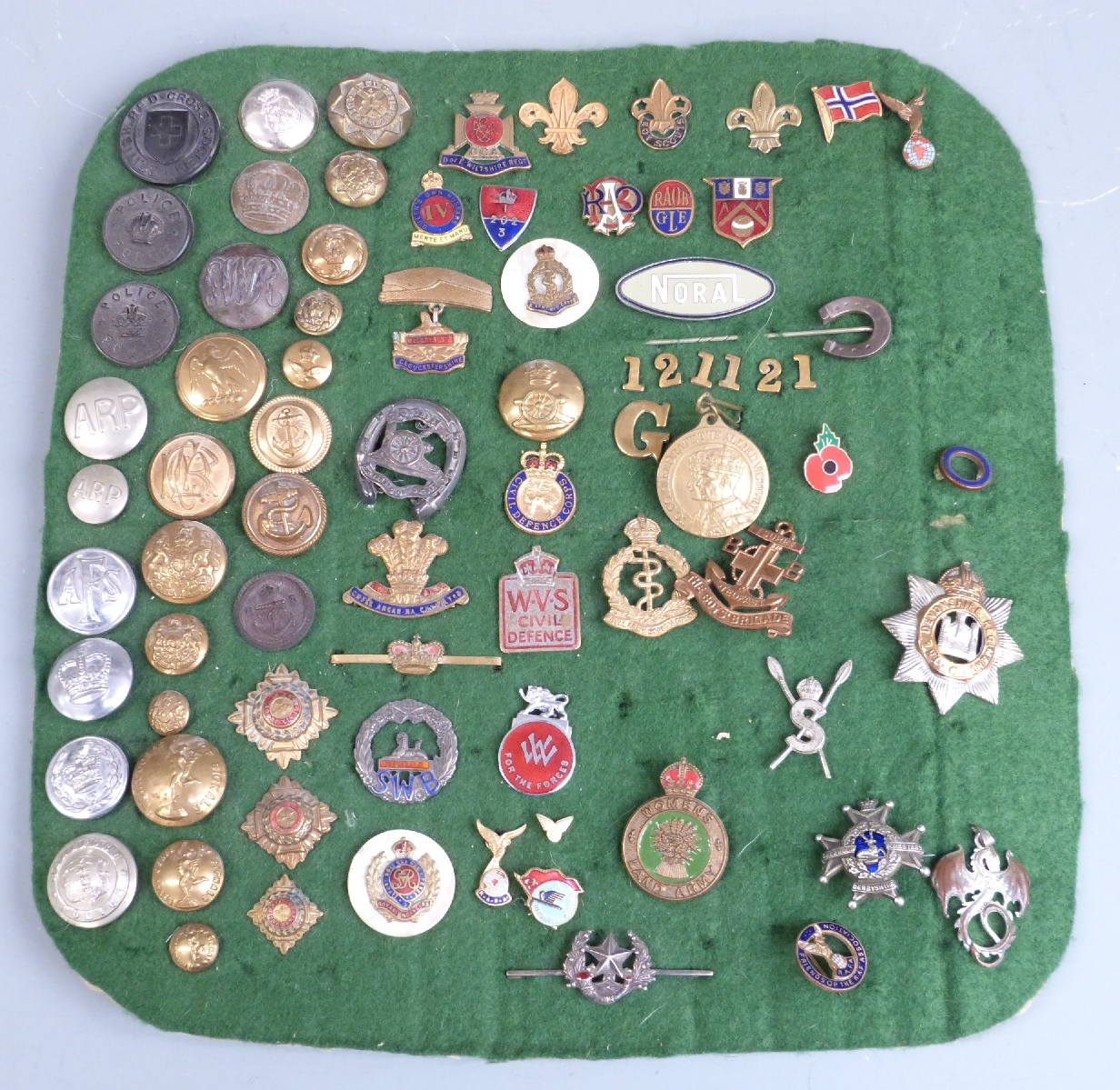 A collection of military buttons, sweetheart brooches and enamel and metal lapel badges including