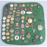 A collection of military buttons, sweetheart brooches and enamel and metal lapel badges including