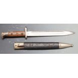 German 71/84 pattern sawback bayonet with muzzle ring and shaped grips, WK&C makers to ricasso, 25cm