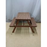 A stained pine picnic bench W135 D128 H75cm