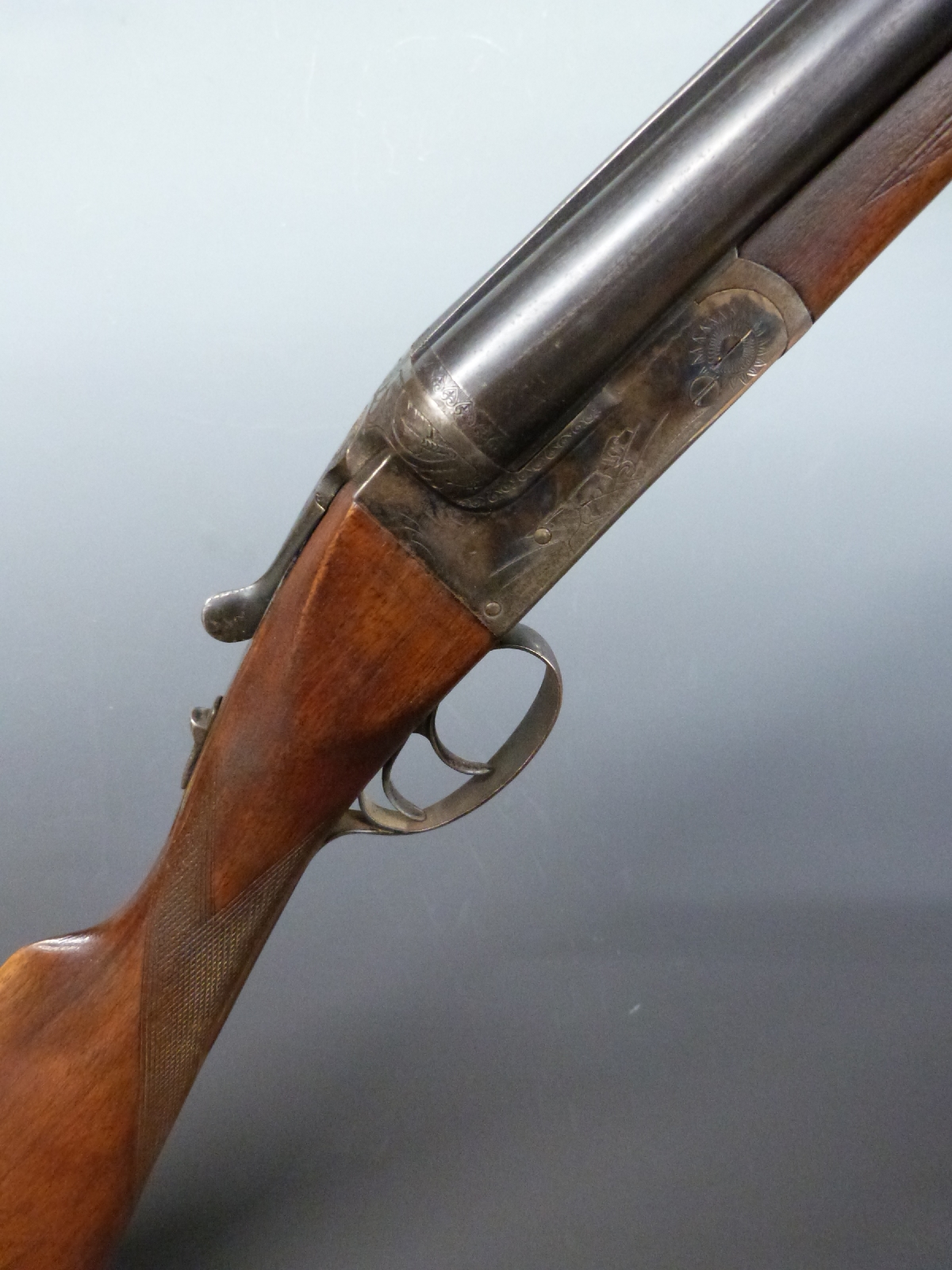Essex 12 bore side by side shotgun with engraved locks, trigger guard underside and top plate,