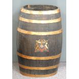 A coopered oak barrel in the form of a stick or umbrella stand marked with an armorial crest, H62