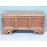 An 18th/19thC three panel oak coffer raised on carved scrolling feet, W126 D50 H60cm