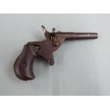 J G Anchutz .177 blank firing hammer action cyclists pocket or muff pistol with shaped grips and 2.5