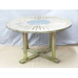 A circular teak garden table, diameter 132cm