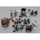 Eight multiplier fishing reels including Abu Ambassadeur 12, International 20, Intrepid Pirate,